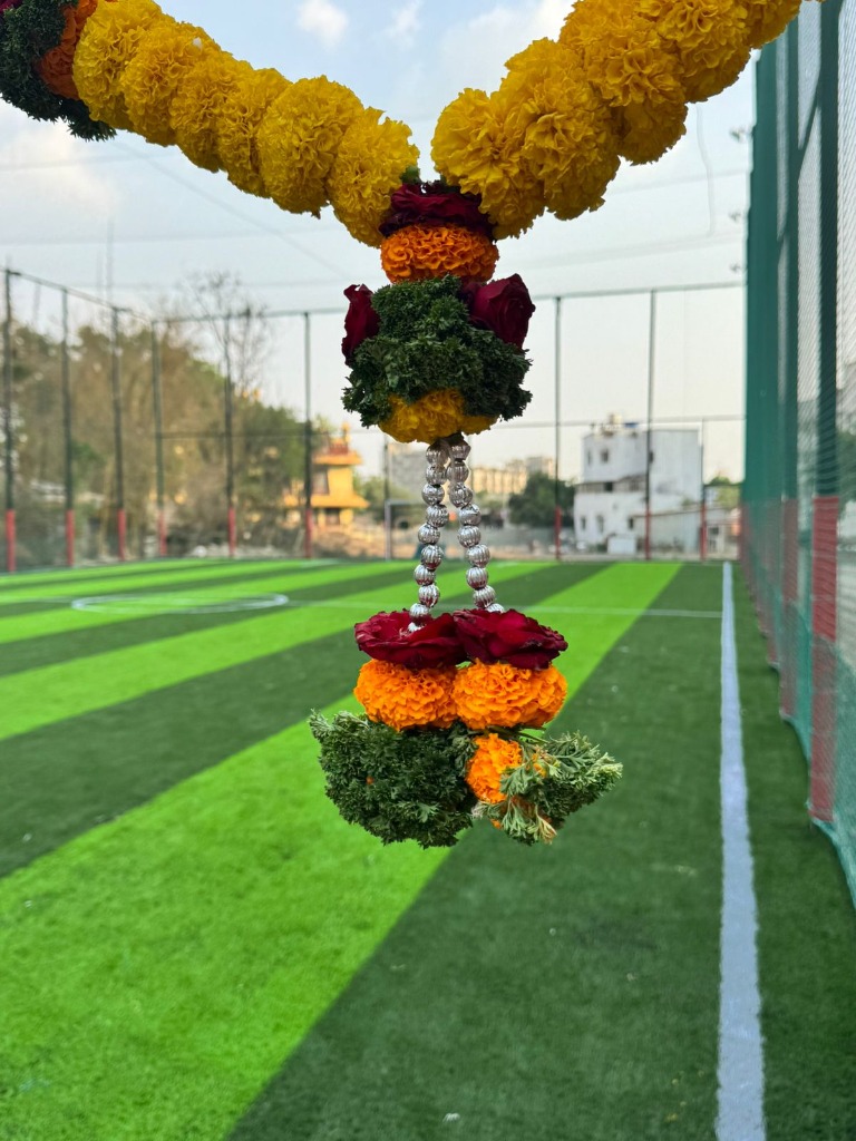 Castle Sports Academy premium turf facility with beautiful floral decoration at inauguration